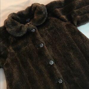 Size 6x little girl's chocolate brown faux fur coat.